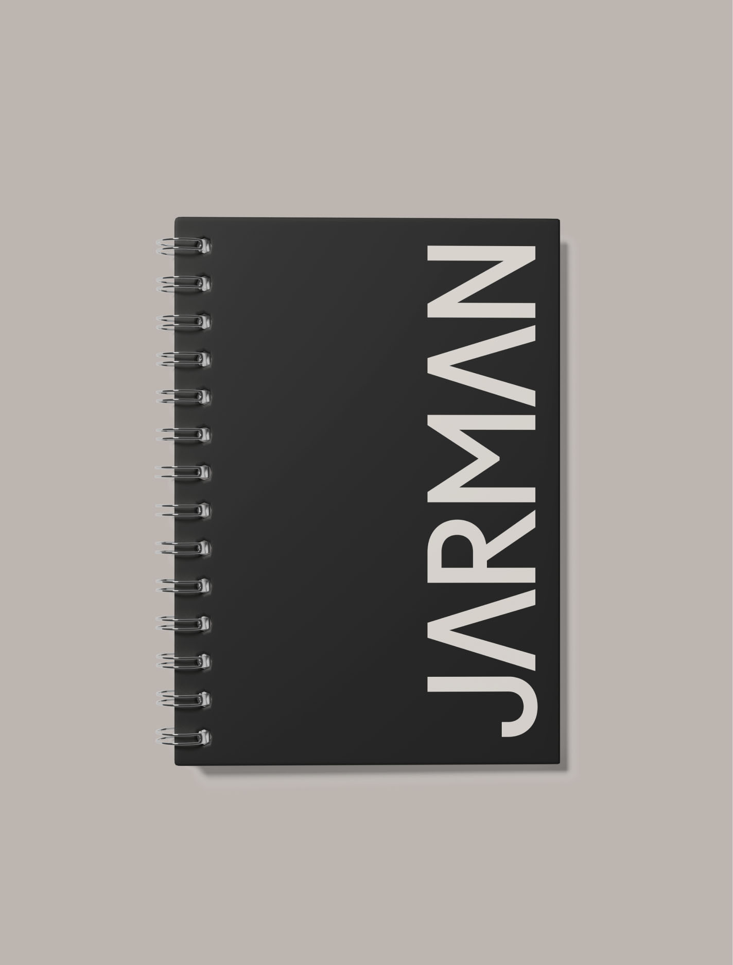 Black Jarman Professional spiral notebook with vertical white wordmark.