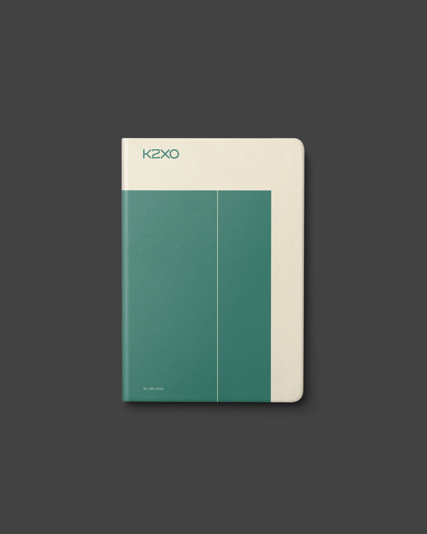 Teal K2XO notebook featuring minimal geometric line graphics.