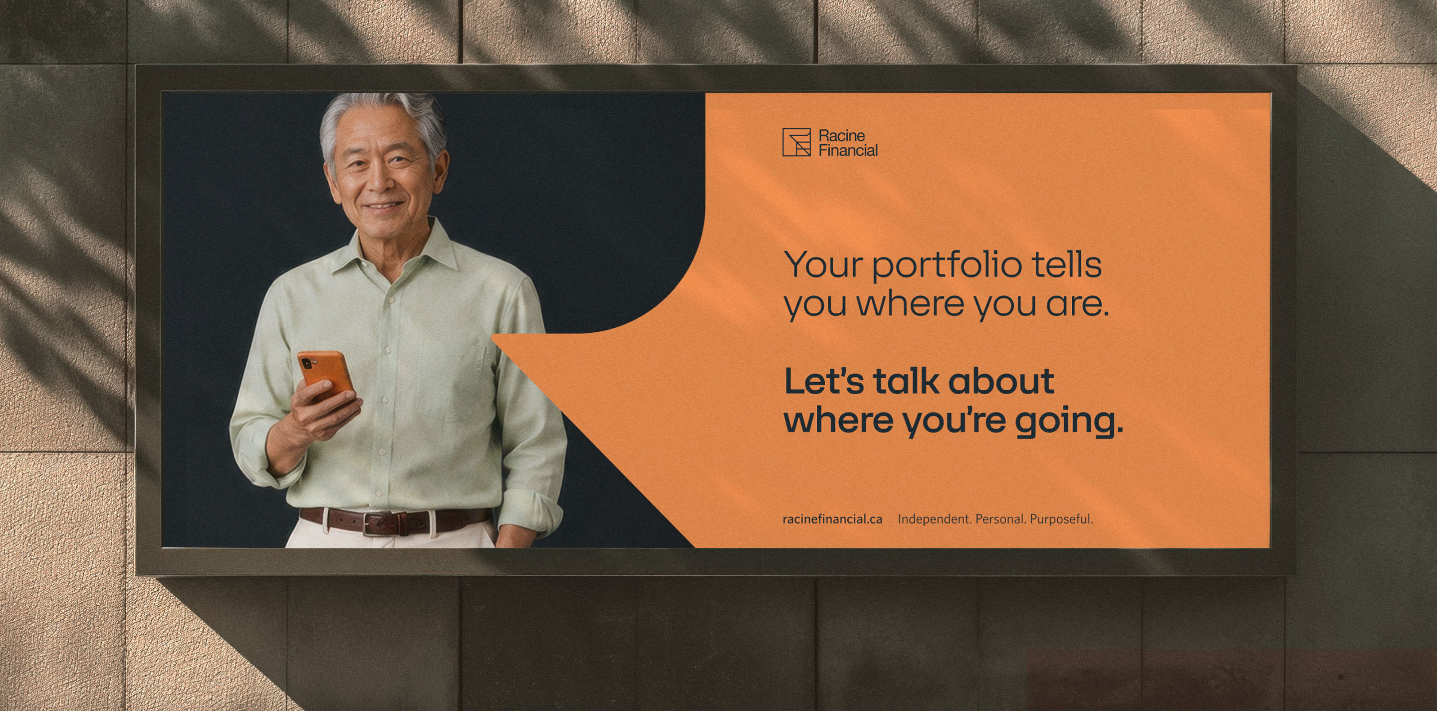 Racine Financial billboard featuring a client portrait and retirement planning message.